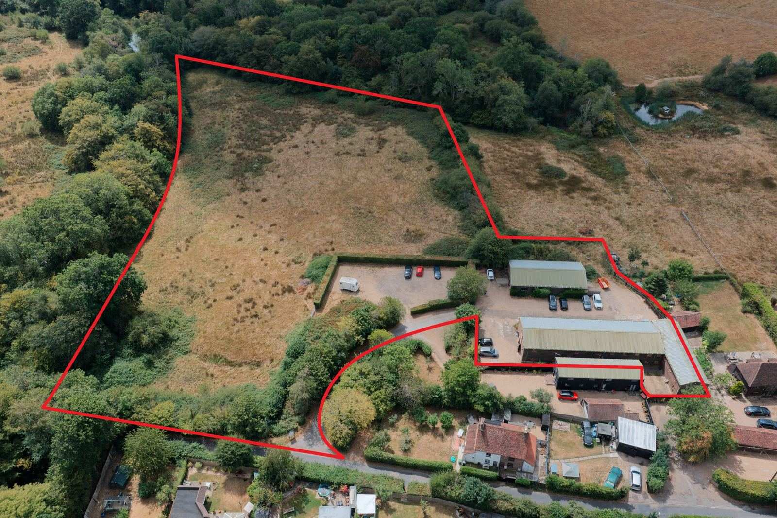 Aerial view of Monkhurst House and grounds with the property boundary marked in red